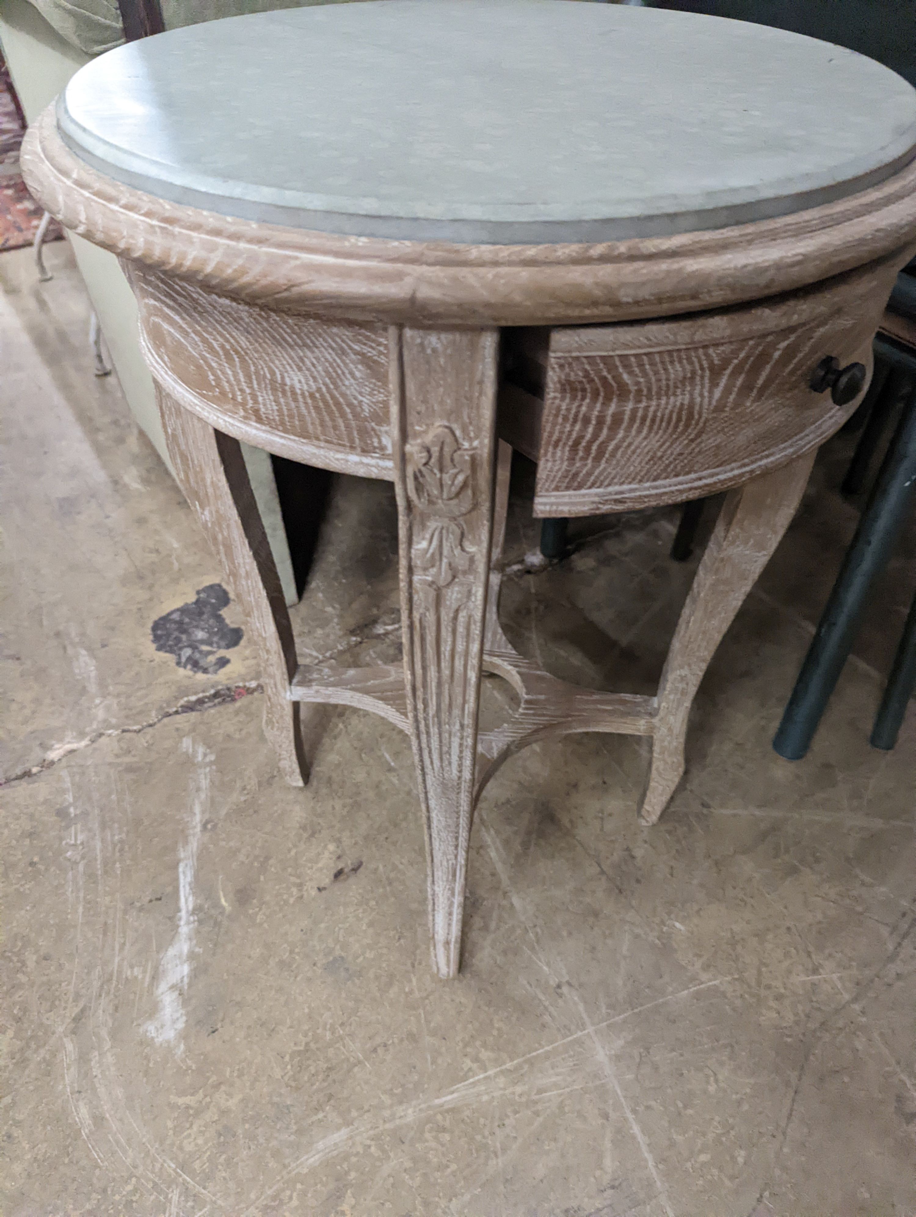 A pair of circular bleached oak occasional tables, stone inset tops, diameter 44cm, height 60cm